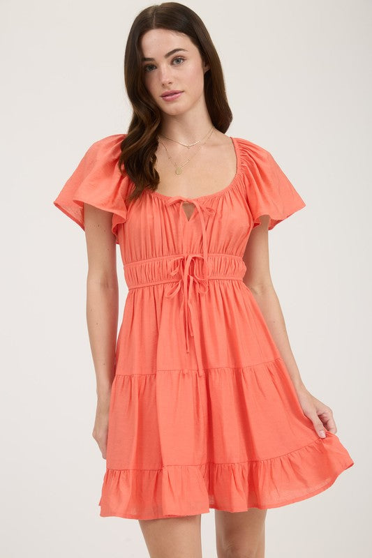 Front Tie Strap Short Sleeve Tiered Mini Dress – Willow at Merle Norman Front Tie Strap Short Sleeve Tiered Mini Dress – Willow at Merle Norman