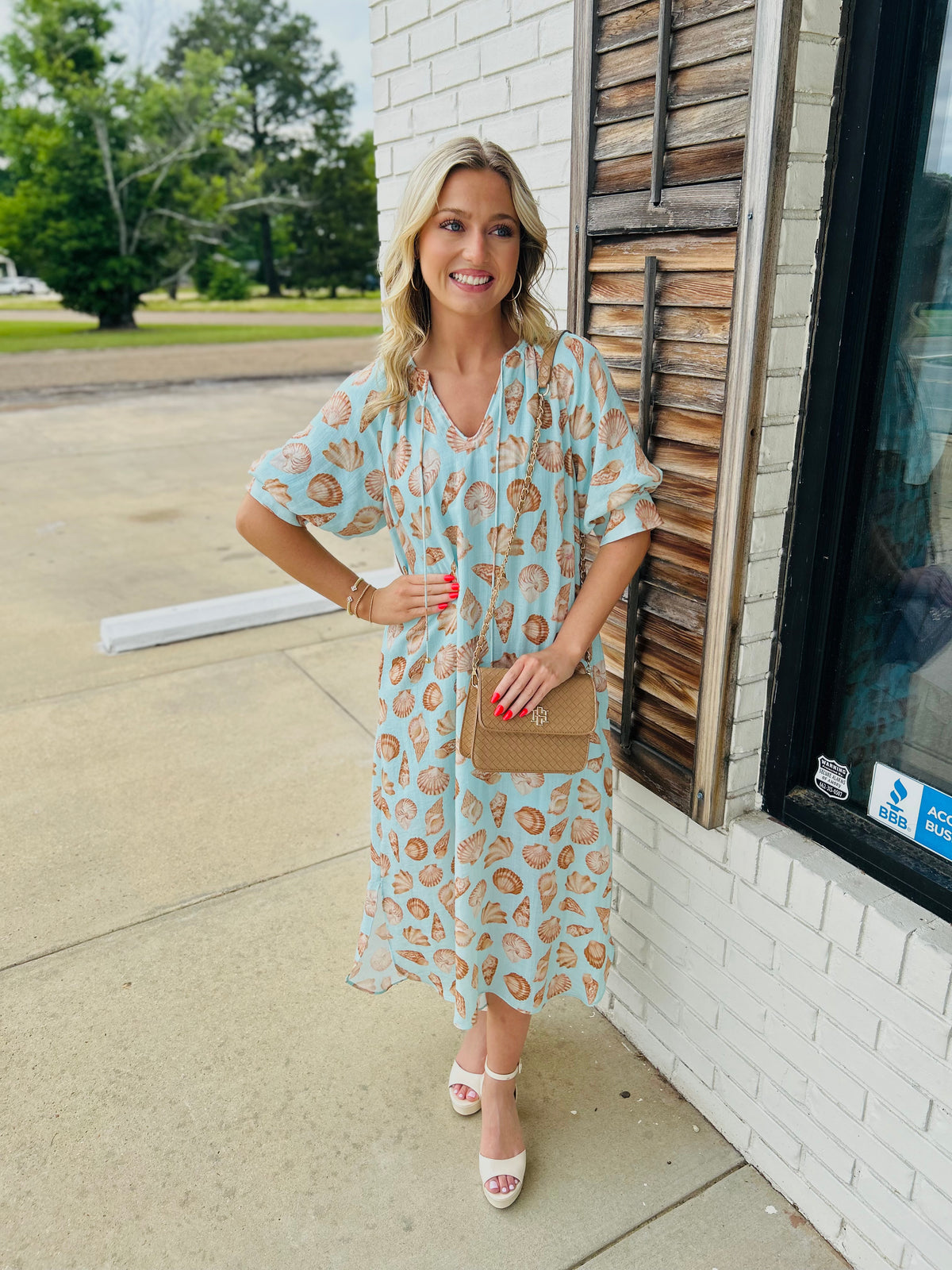 Shell print short sleeve midi dress featuring tie neckline with tassel detail
