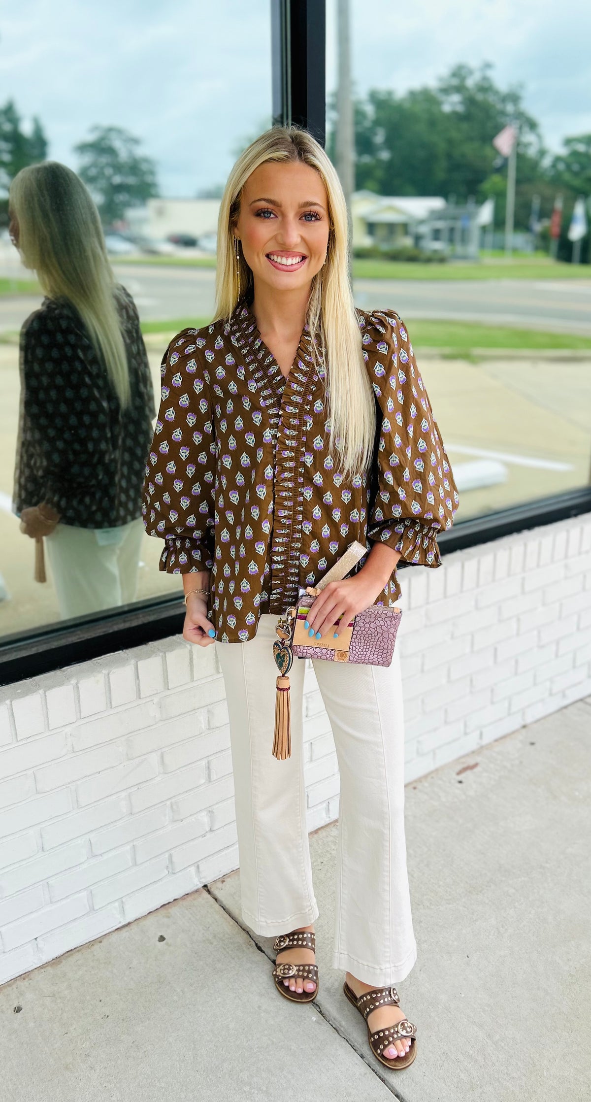 ¾ puff sleeve top featuring smocked V-neck detail