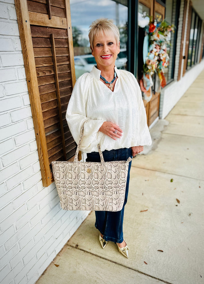 Solid balloon sleeve V-neck top featuring pleated shoulder detail