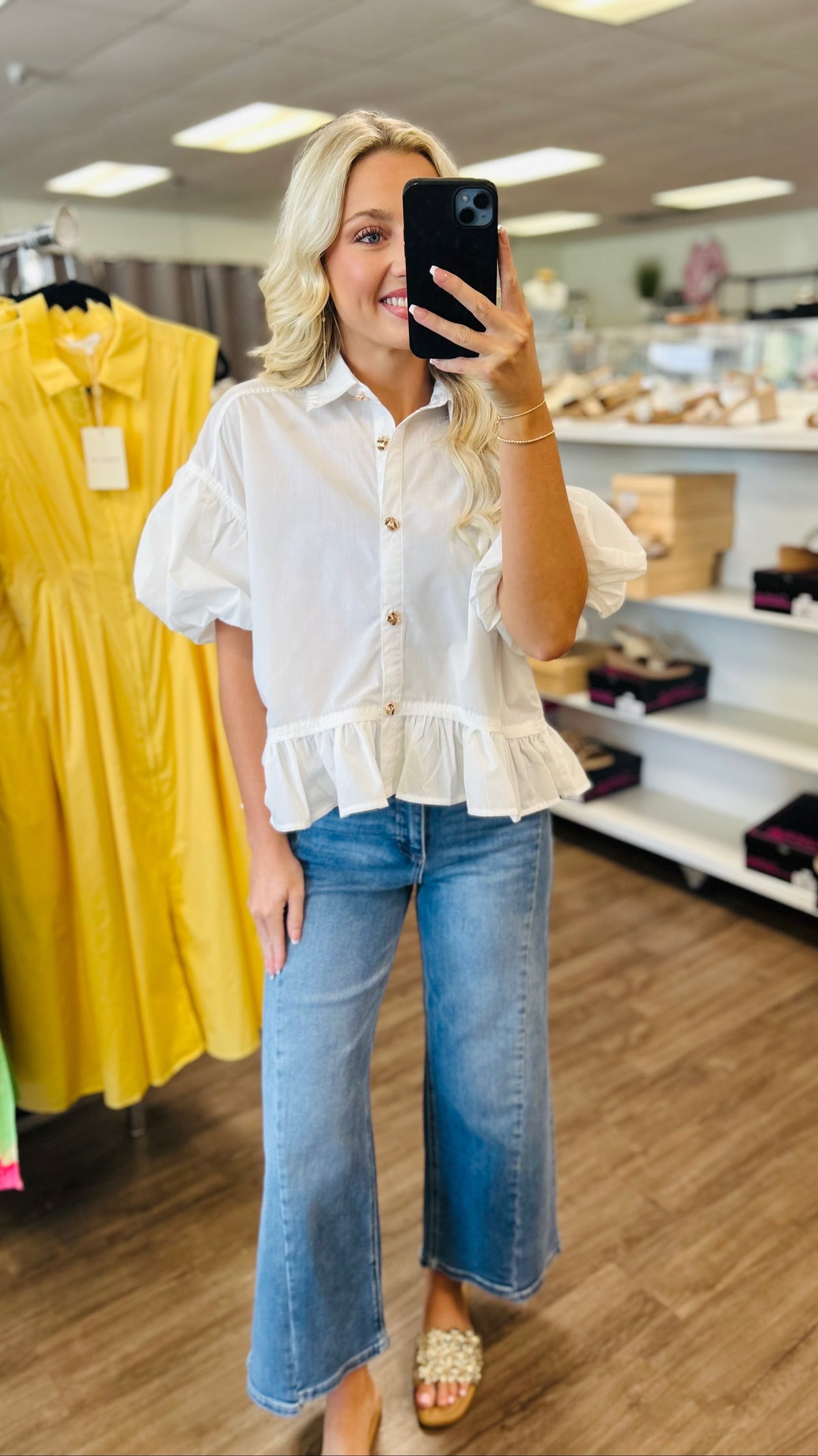 Solid short puff sleeve top featuring ruffle hem detail