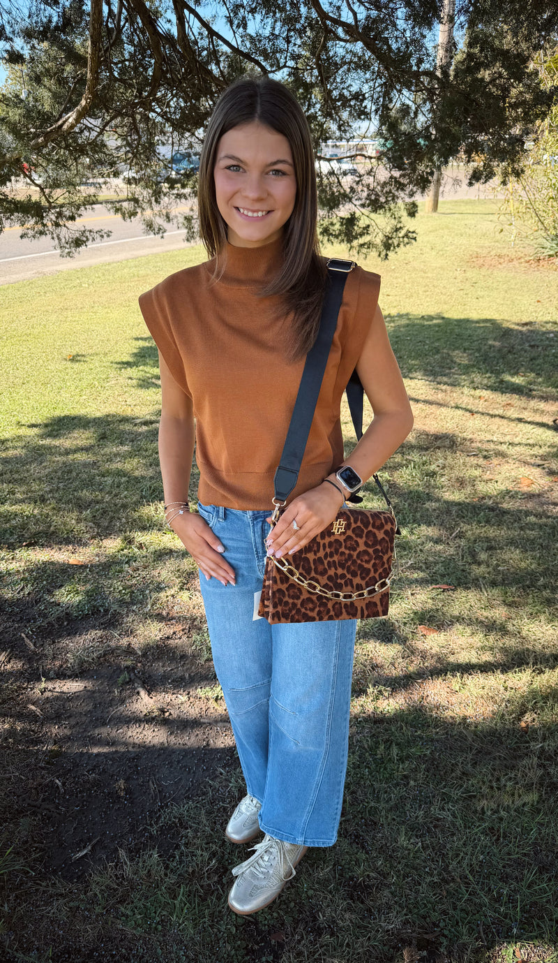 Solid mock neck sleeveless knit top