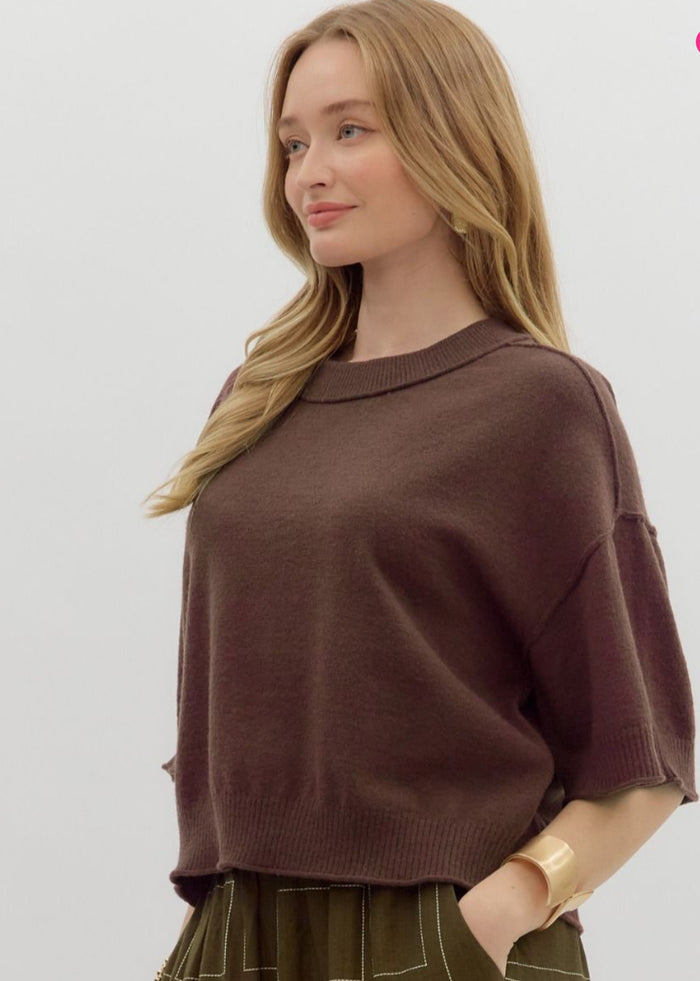 Solid sweater knit ¾ wide sleeve pullover.