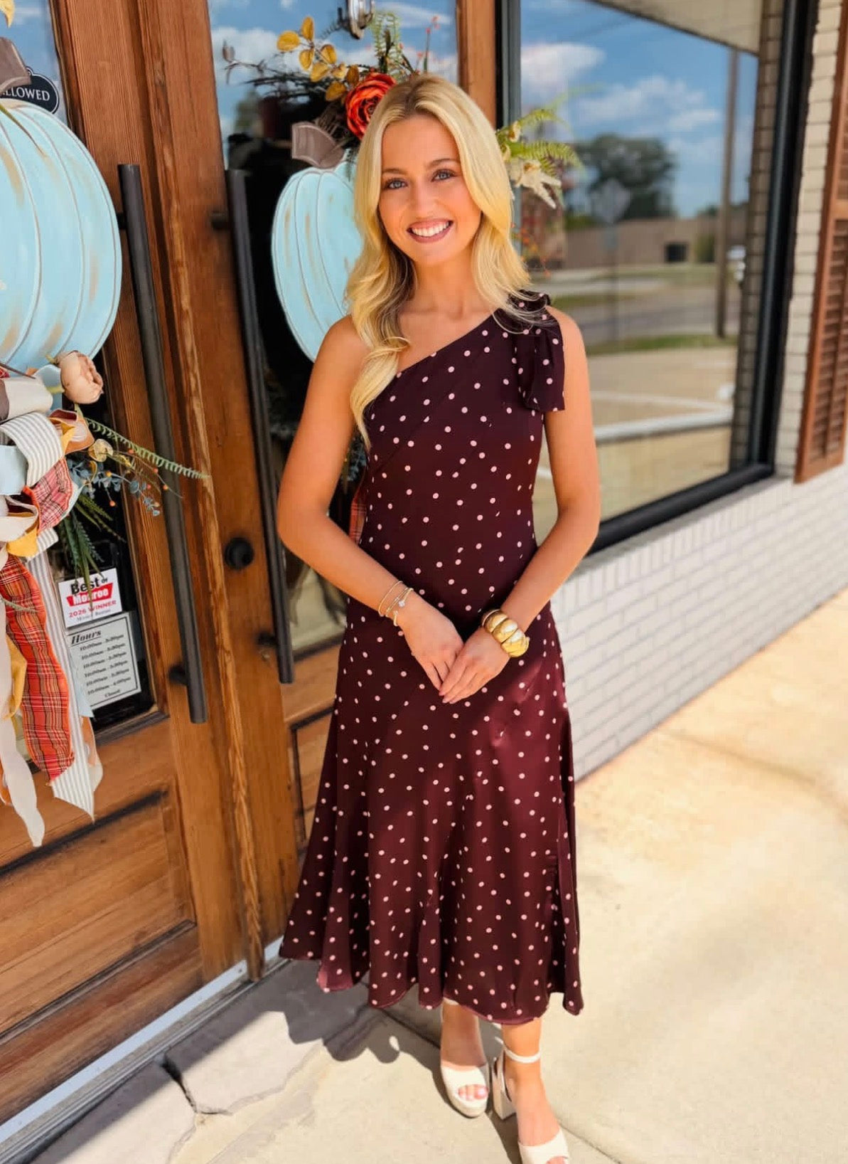 Silky satin midi dress featuring a one-shoulder neckline with oversized bow detail