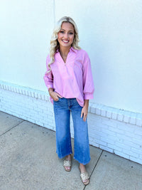 Striped 3/4 sleeve top featuring split neck placket detai