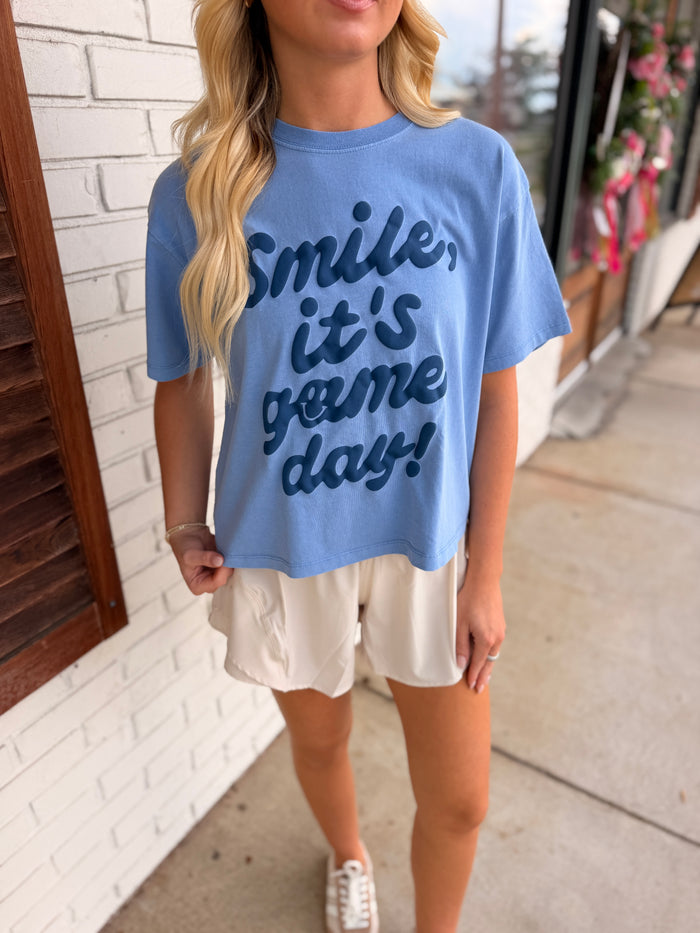Smile, It’s Game Day Blue Crop Tee