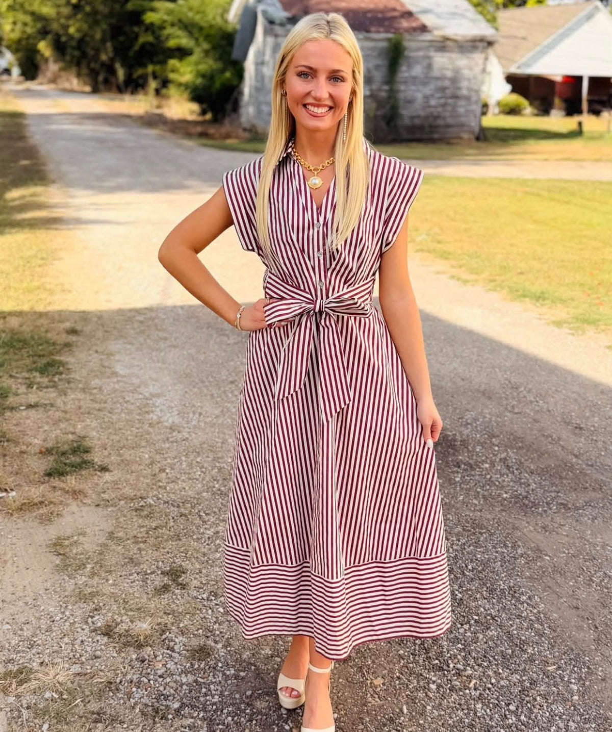 Striped cap sleeve midi dress featuring V-neck with self-tie detail