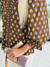 ¾ puff sleeve top featuring smocked V-neck detail
