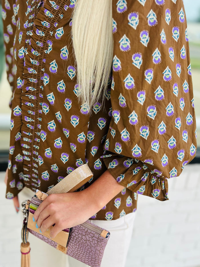 ¾ puff sleeve top featuring smocked V-neck detail