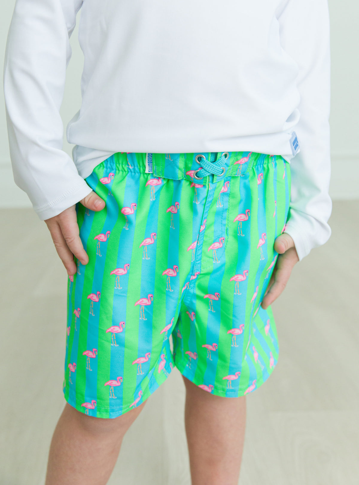 RuggedButts Neon Flamingo Stripe Swim Trunks