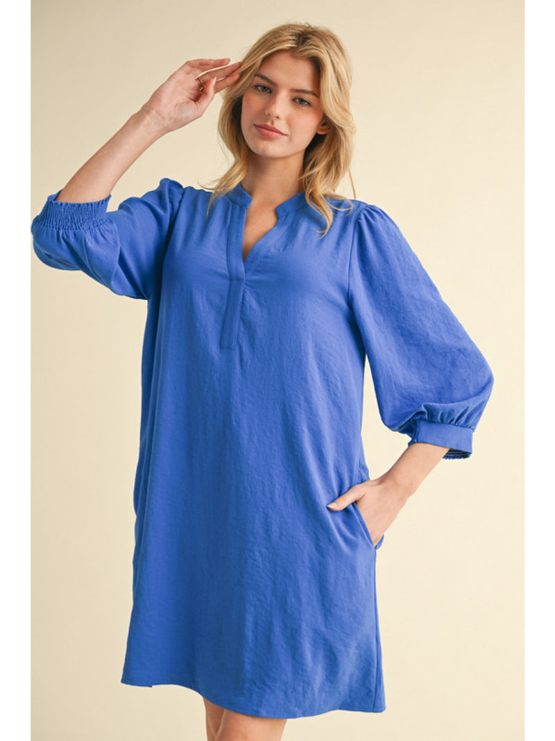 Solid dress with split U-neck, and three quarter peasant sleeves,