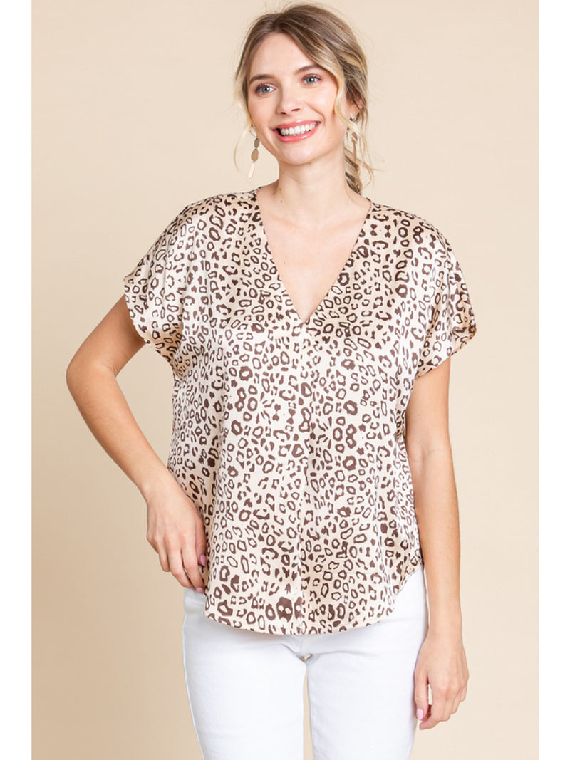 Satin leopard print top with a V-neck, and short sleeves.