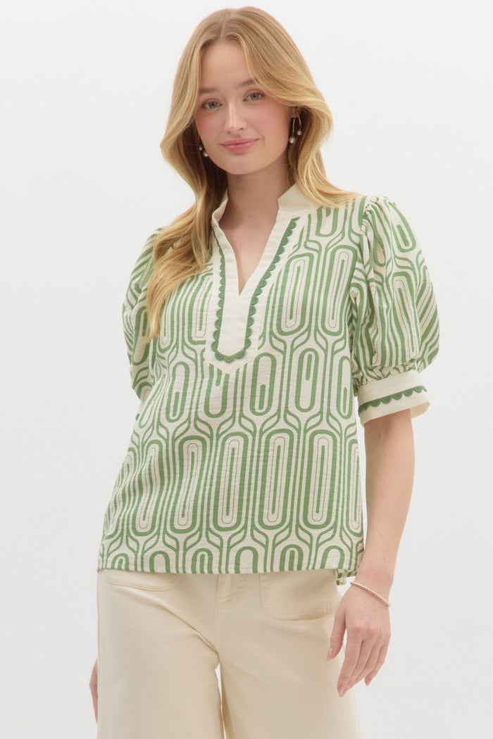 Abstract print highneck collar band pullover top featuring scallop trim