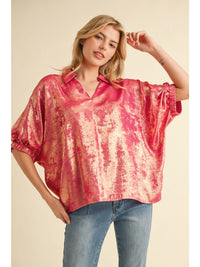 Metallic top with open collared neck, Half dolman sleeves, and stretch-band cuffs.