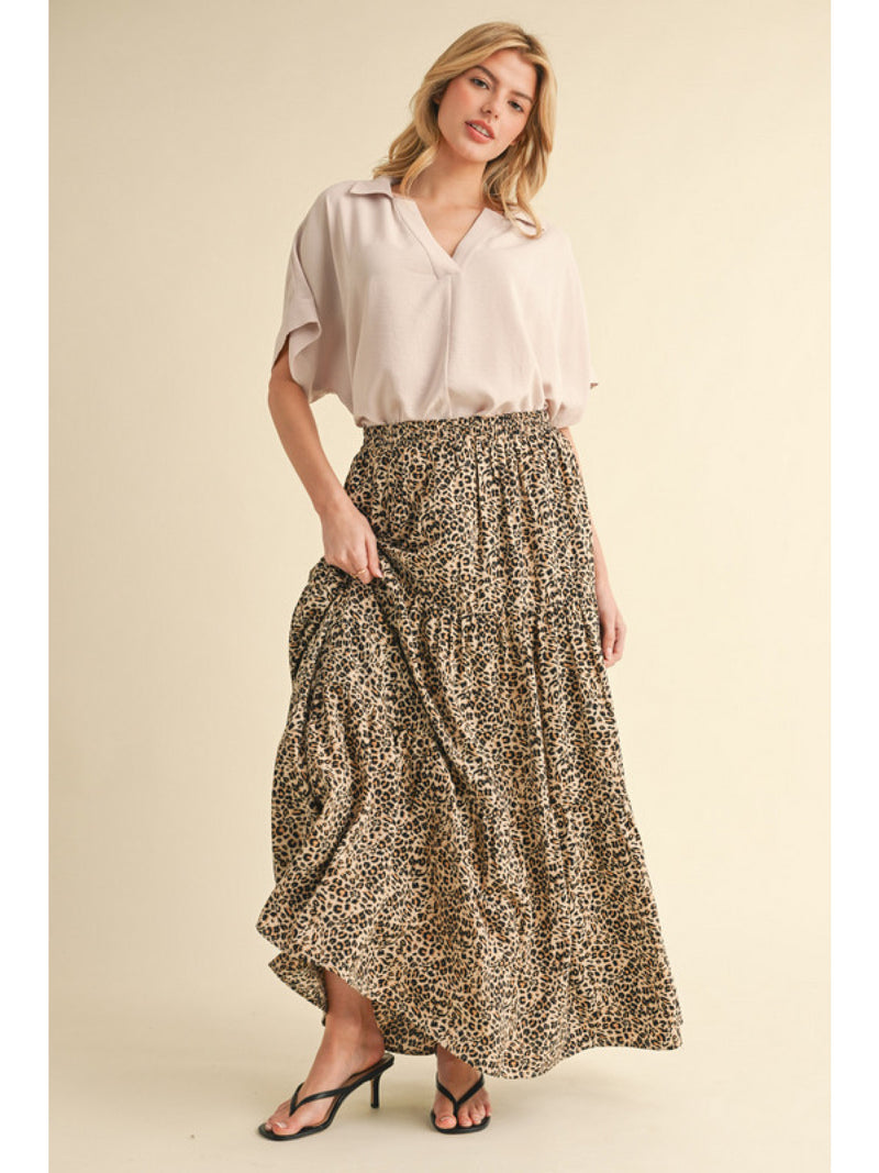 Leopard full skirt with stretch-band waistline, side pockets, and tiered layer.