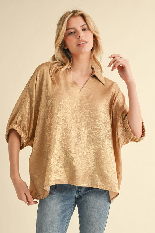 Plus Metallic top with open collared neck, Half dolman sleeves, and stretch-band cuffs.