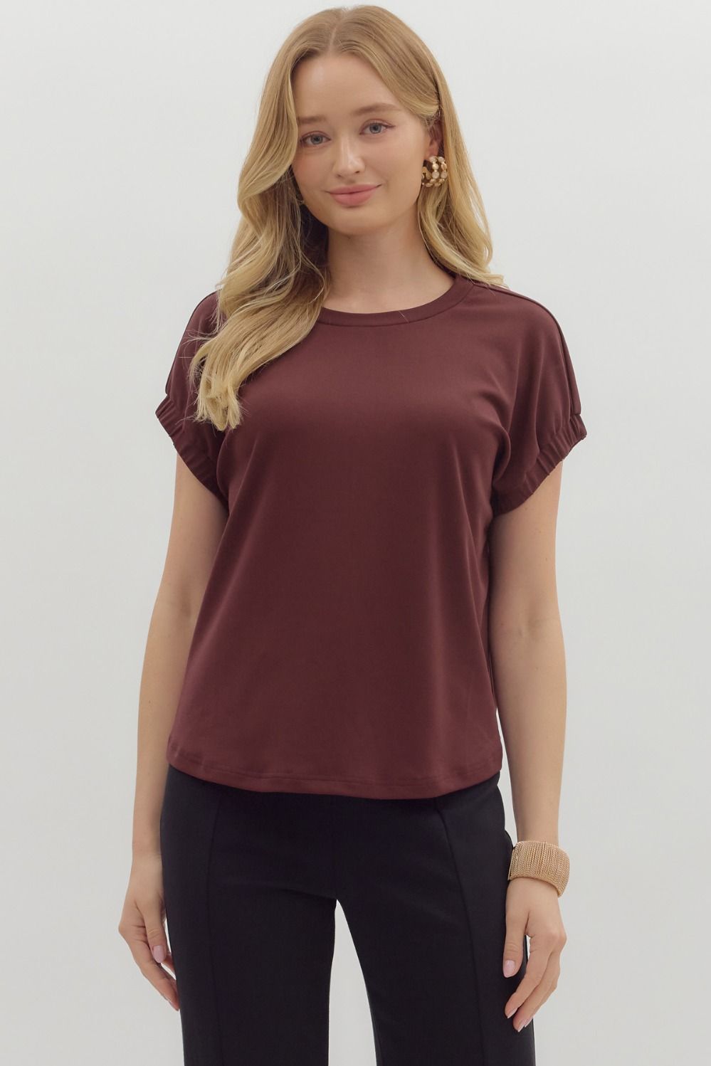 Solid pullover jersey knit top featuring elasticated sleeve openings