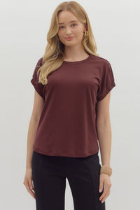 Solid pullover jersey knit top featuring elasticated sleeve openings