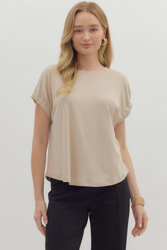 Solid pullover jersey knit top featuring elasticated sleeve openings