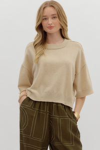 Solid sweater knit ¾ wide sleeve pullover.