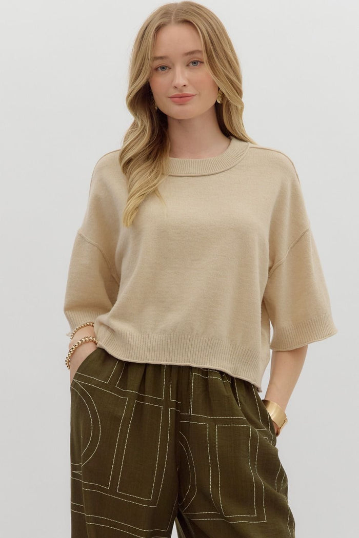 Solid sweater knit ¾ wide sleeve pullover.