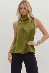 Solid sleeveless mock neck top featuring draped front
