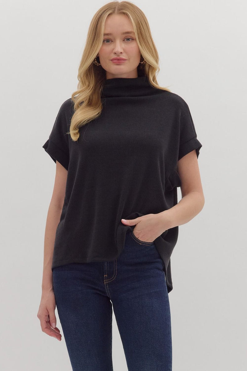 Solid short sleeve mock neck top featuring rolled cuffs