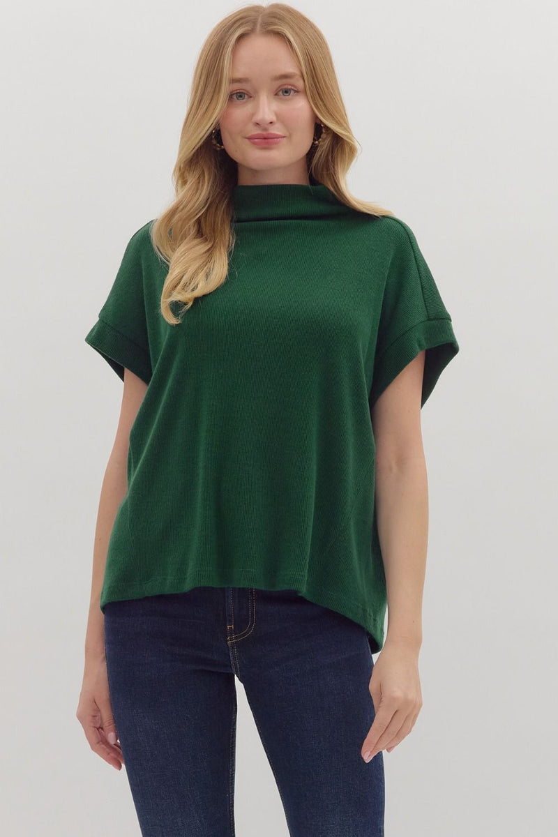 Solid short sleeve mock neck top featuring rolled cuffs