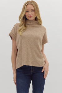 Solid short sleeve mock neck top featuring rolled cuffs