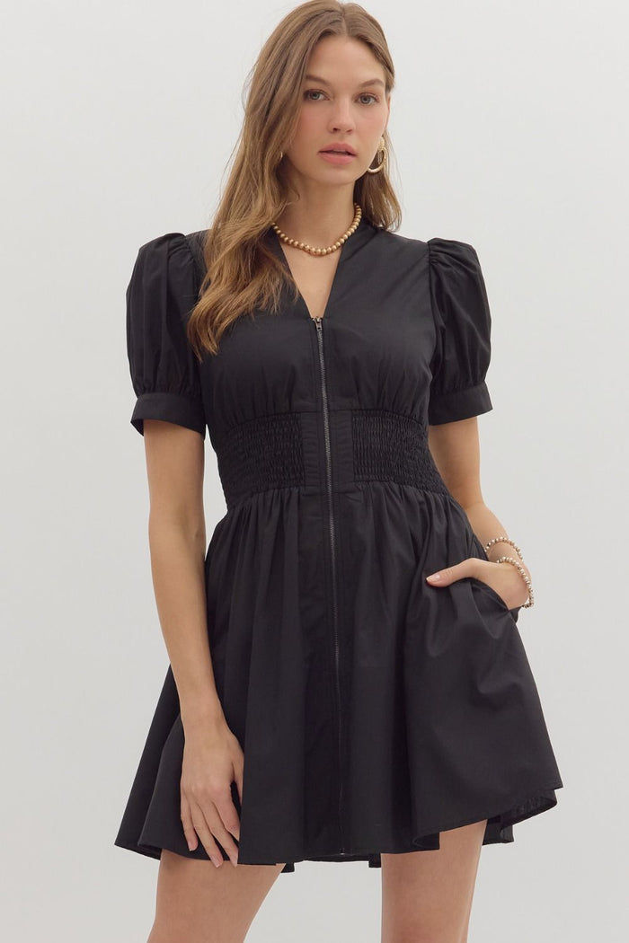 Solid short puff sleeve V-neck mini dress featuring smocked waist front-zip closure.