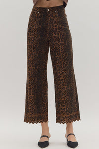 Leopard pattern pants featuring floral embroidered hem