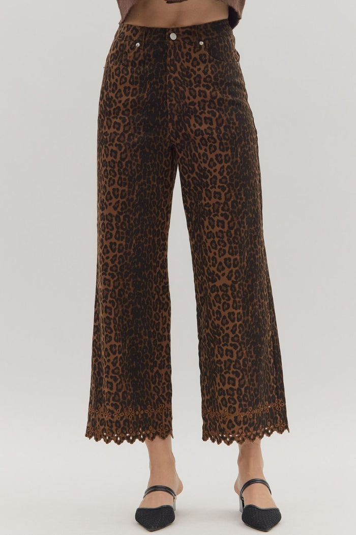 Leopard pattern pants featuring floral embroidered hem