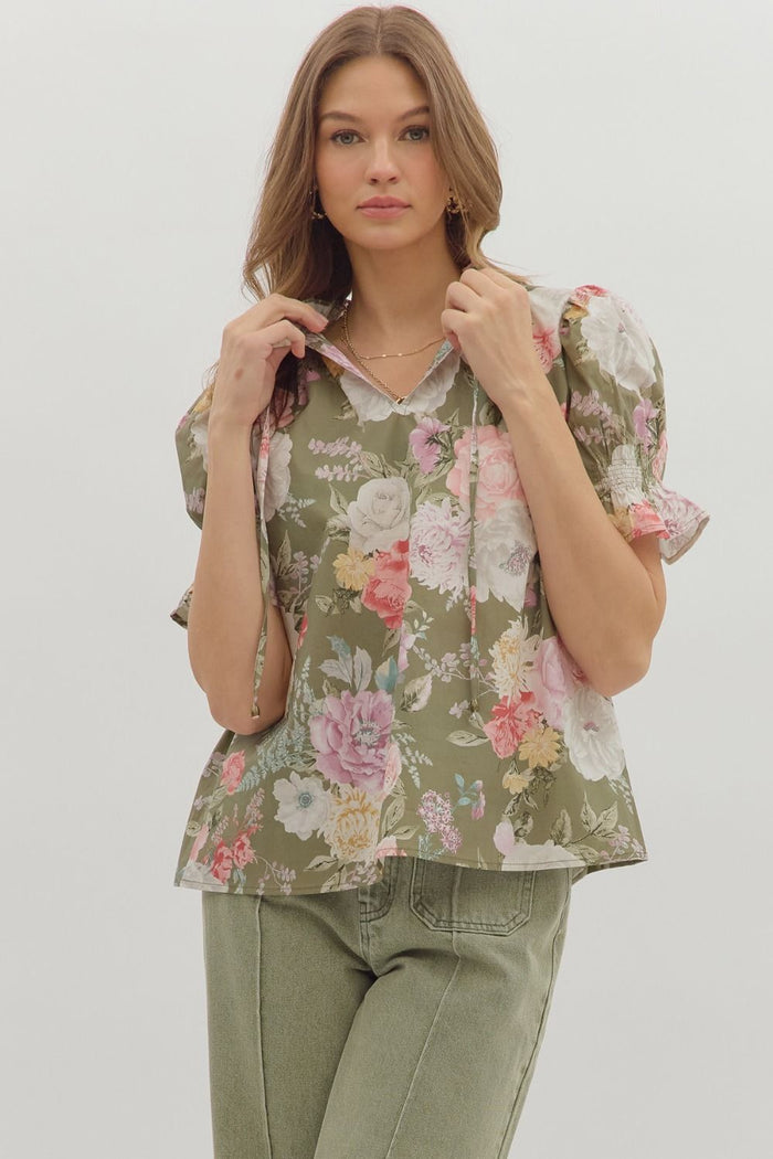 Floral print smocked short puff sleeve ruffle finish V-neck top.