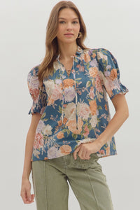 Floral print smocked short puff sleeve ruffle finish V-neck top.