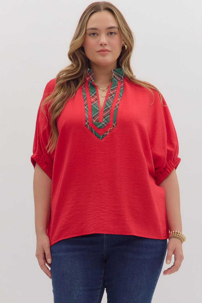 Solid short sleeve dolman top featuring plaid pattern contrast high V-neck