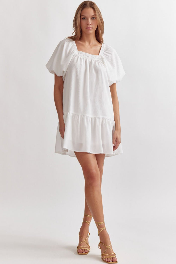 Textured short sleeve square neck dress featuring smocking along necklin
