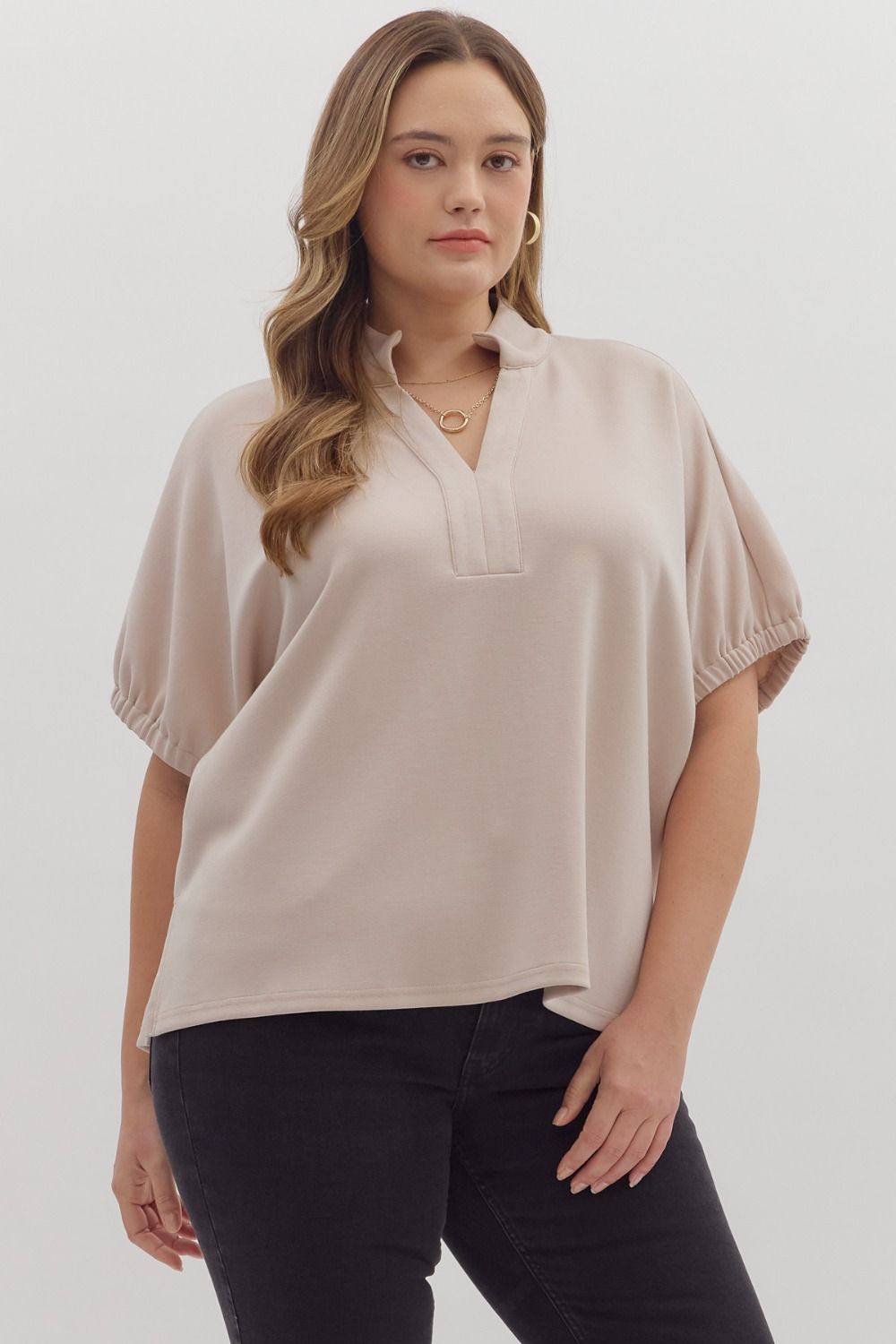 Solid short sleeve top featuring split V-neck with collar band