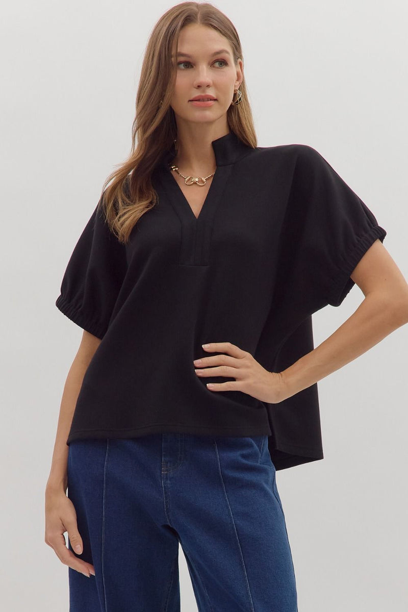 Solid short sleeve top featuring split V-neck with collar band