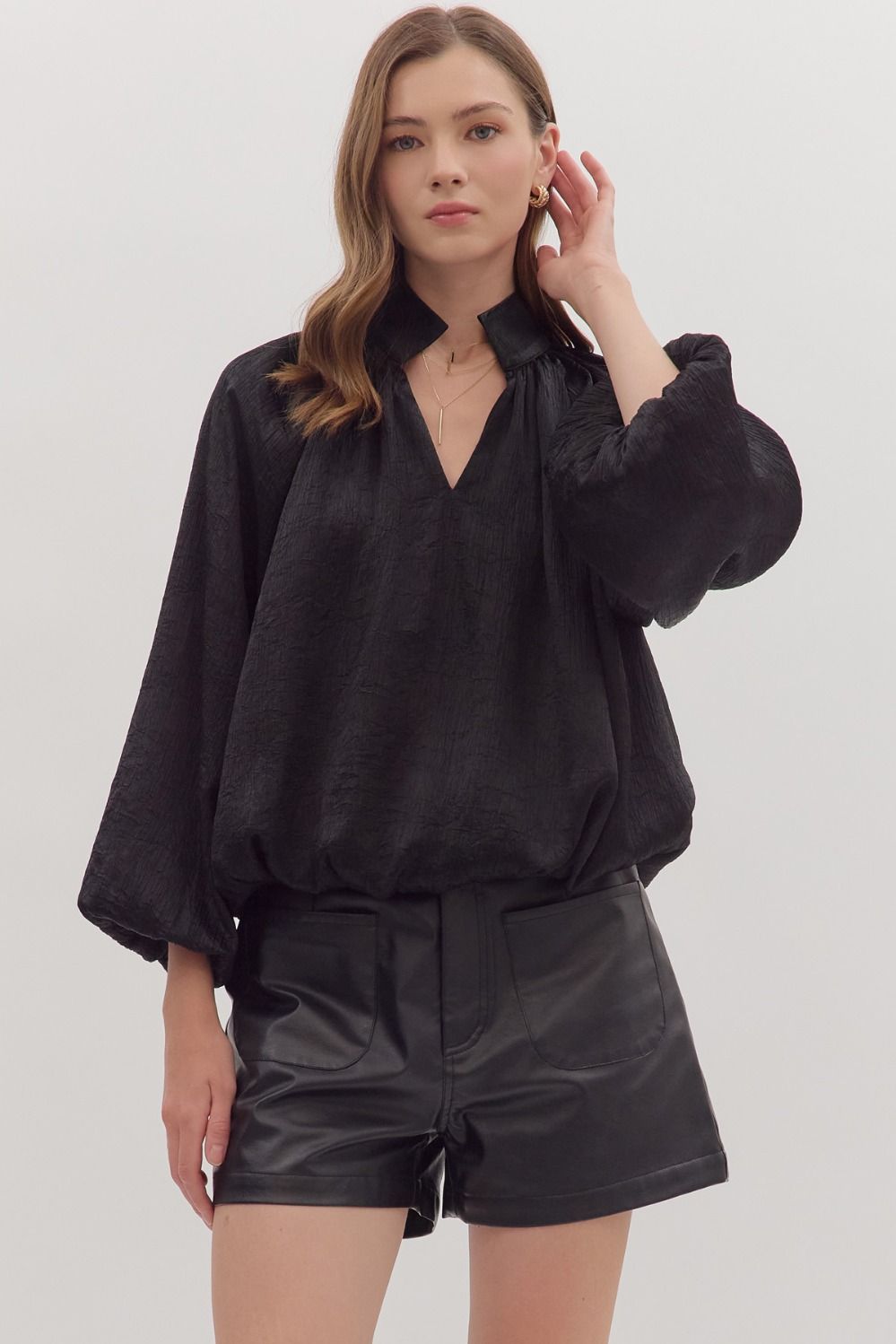 Solid balloon sleeve V-neck top featuring pleated shoulder detail