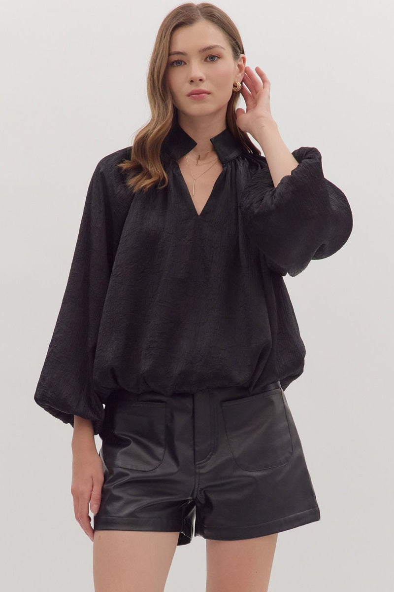 Solid balloon sleeve V-neck top featuring pleated shoulder detail