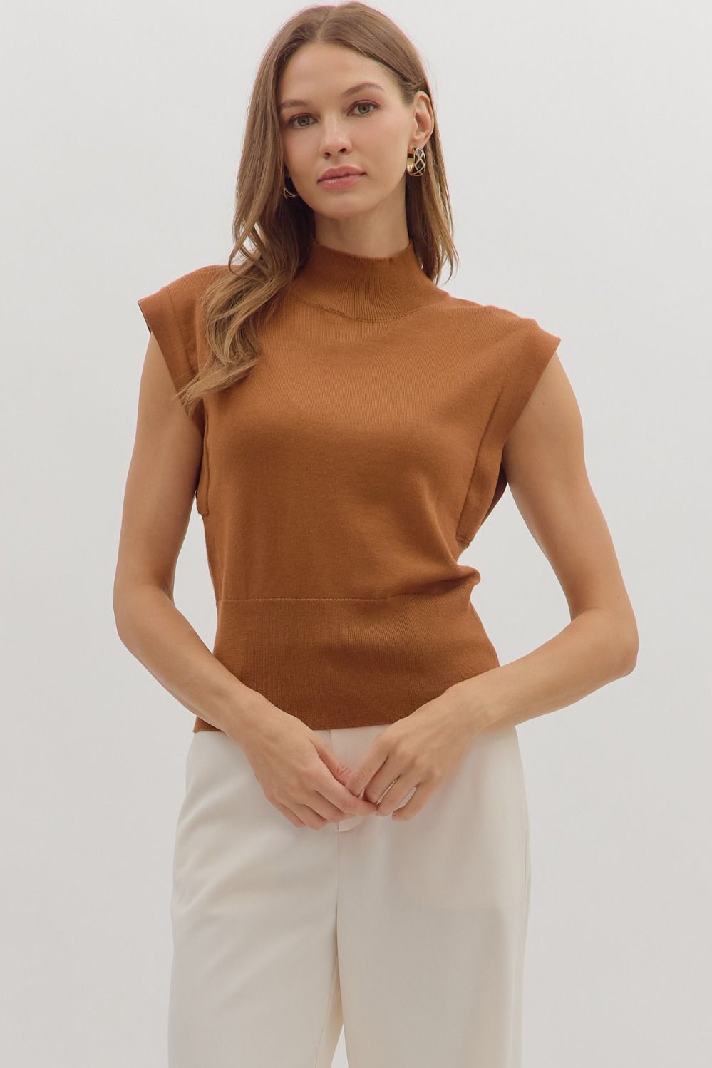 Solid mock neck sleeveless knit top