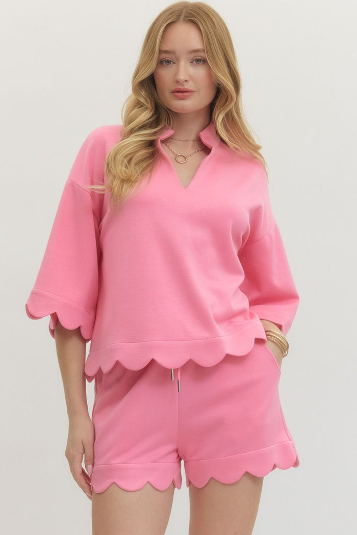 V-neck top featuring scallop accent