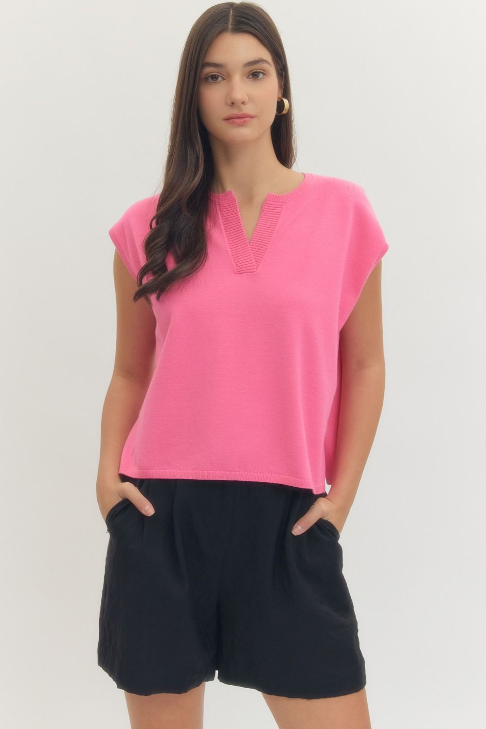 Solid short sleeve knit top featuring ribbed V-neck detail