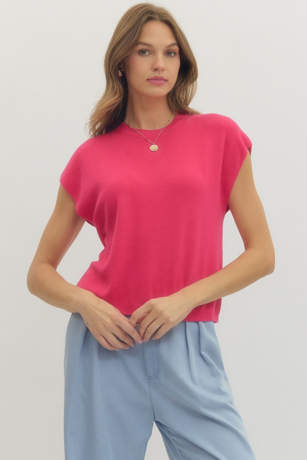Solid cap sleeve knit top featuring round neck