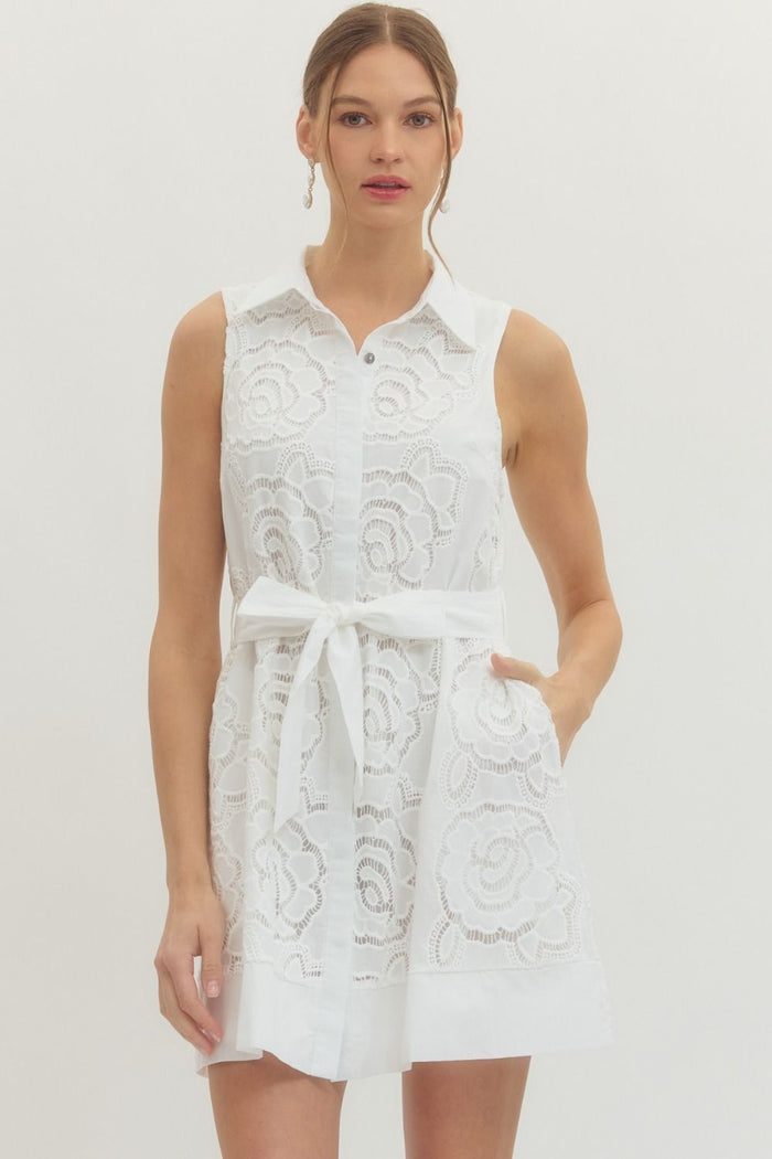 Solid sleeveless mini dress featuring floral lace overlay