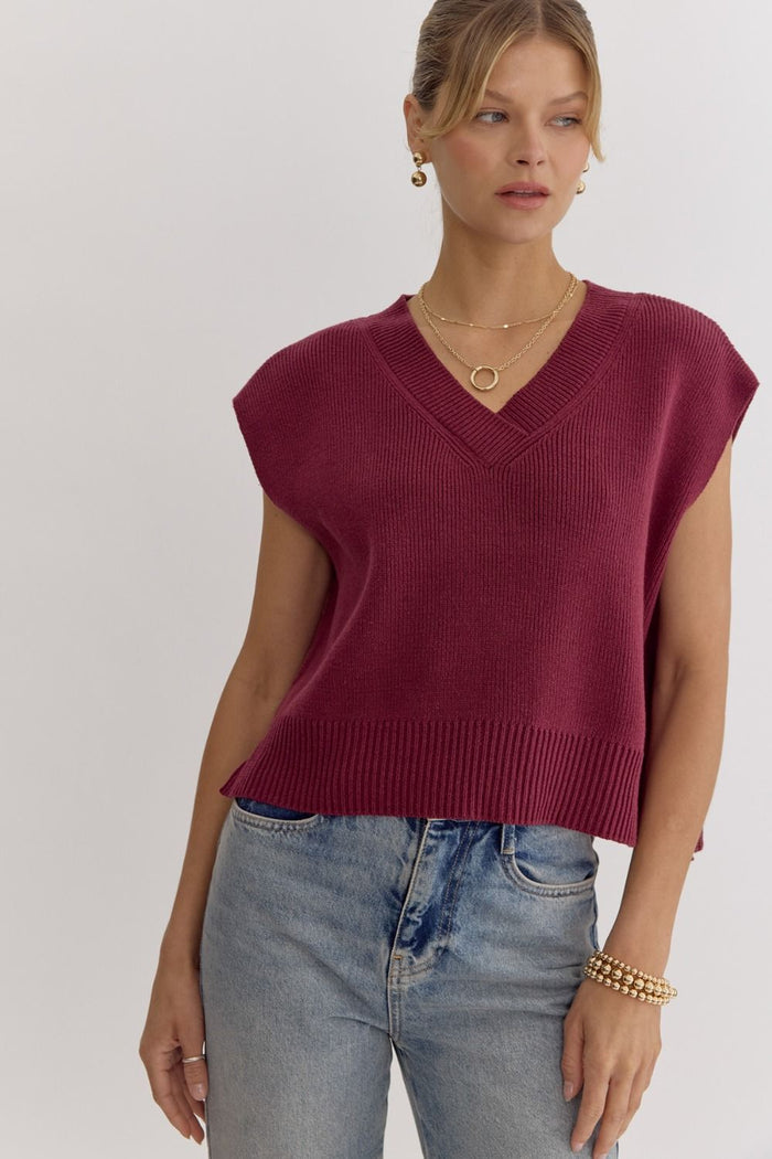 Solid knit v-neck sleeveless top featuring slit at sides