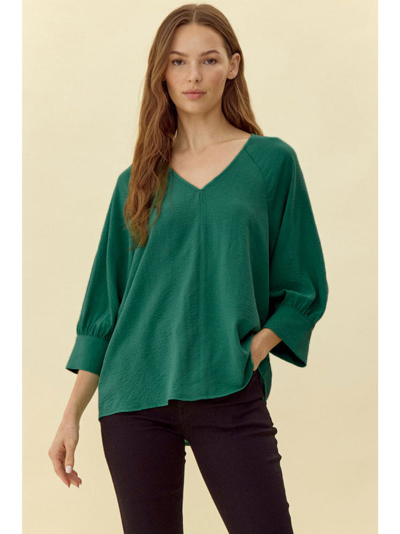 Solid top with a V-neck, raglan 3/4 peasant sleeves,