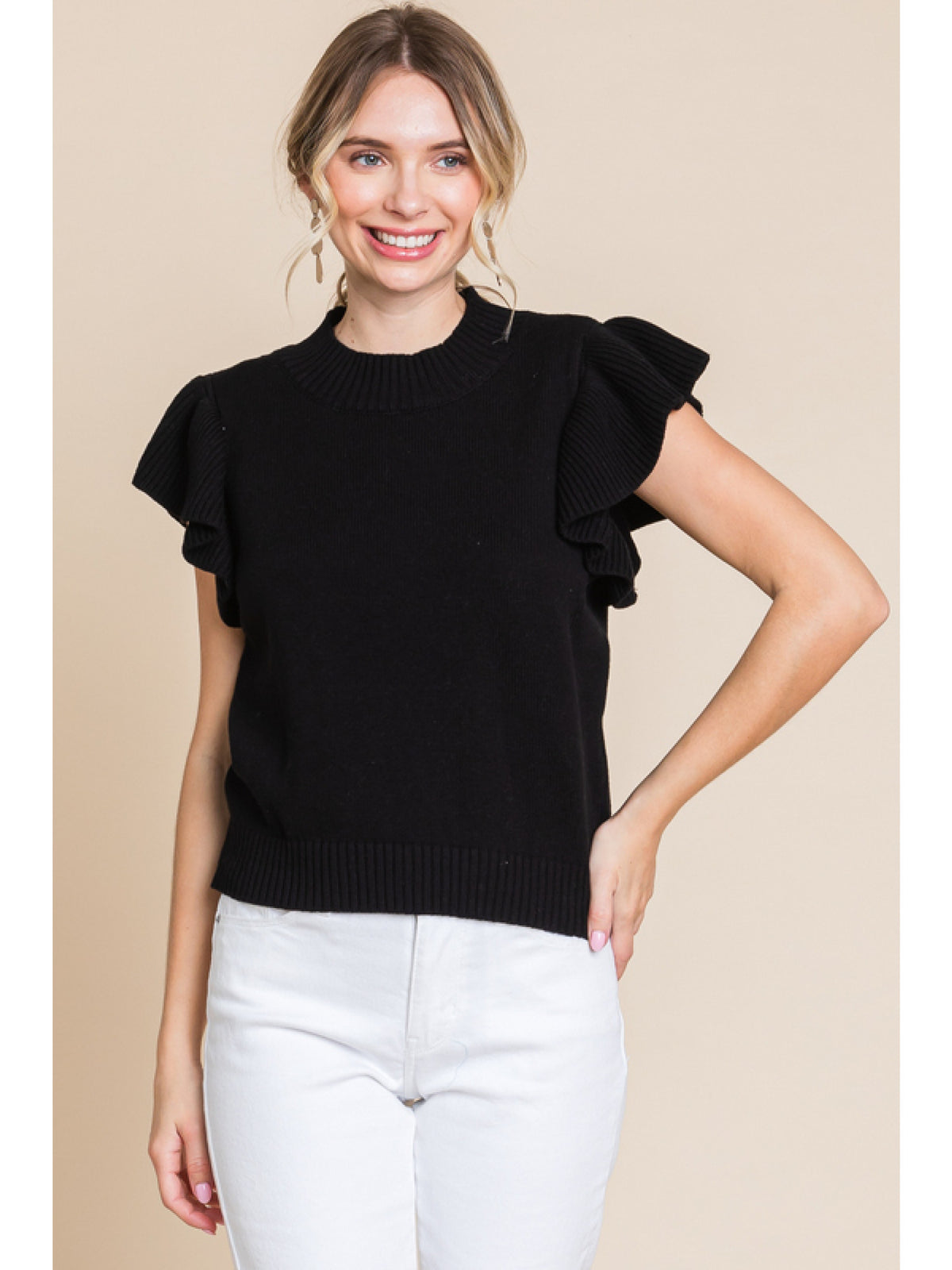 Solid knit top with a crew neck ruffled shoulde