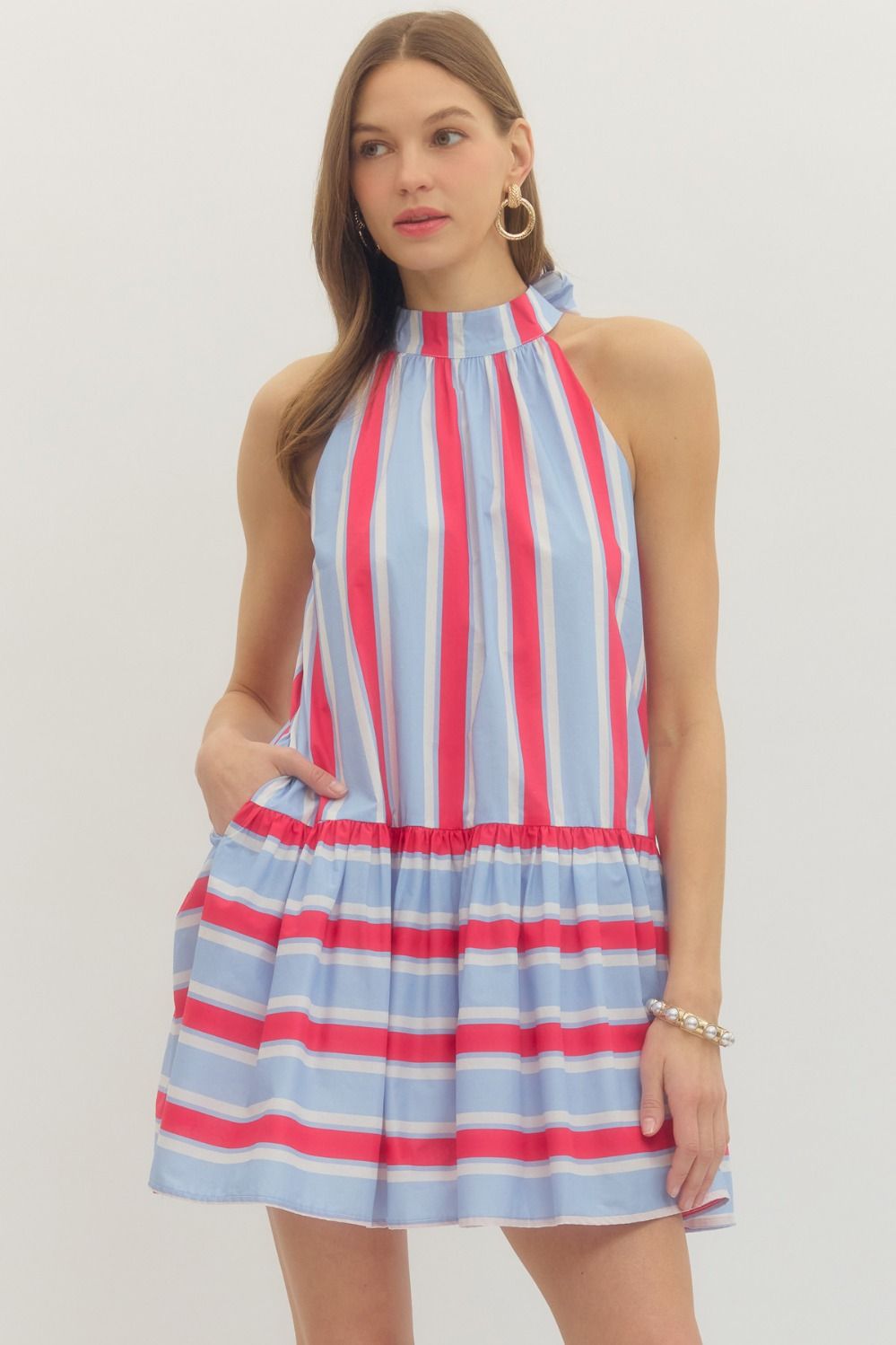 Striped sleeveless mini dress featuring back neck tie.