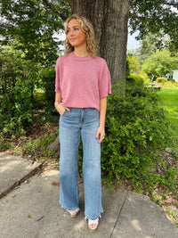 Drop shoulder comfy sweater top with raw edge detail.